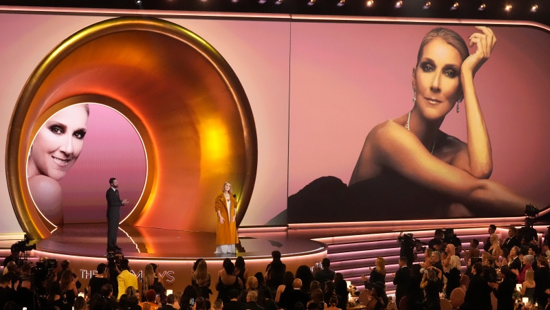 Celine Dion says she 'did not take the time' to figure out her rare neurological disorder and that the burden of lying about her condition became 'too much.' Dion presents the award for album of the year during the 66th annual Grammy Awards on Sunday, Feb. 4, 2024, in Los Angeles. (Chris Pizzello/The Canadian Press/AP)