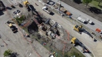 Work continues to repair a broken water main in the community of Montgomery in Calgary, on June 11, 2024. (CTV News) 