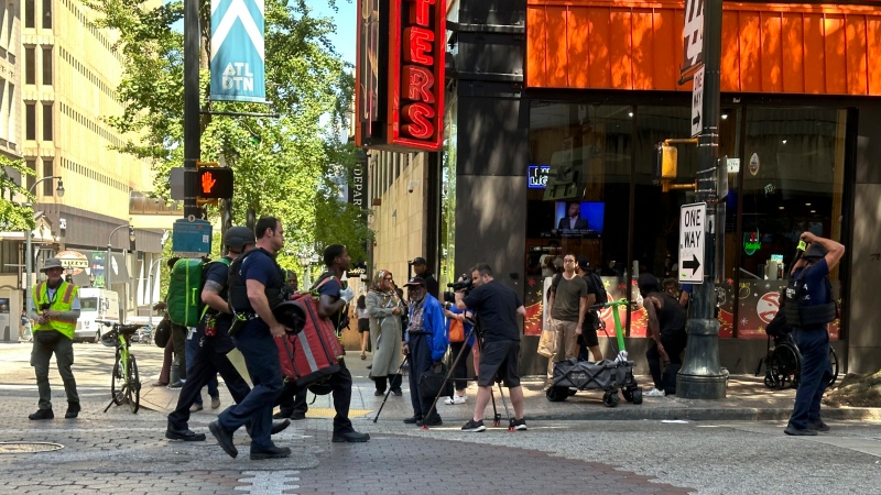 Police respond to the scene of a shooting outside the Peachtree Center complex, Tuesday, June 11, 2024, in downtown Atlanta. (Jeff Amy / AP Photo) 
