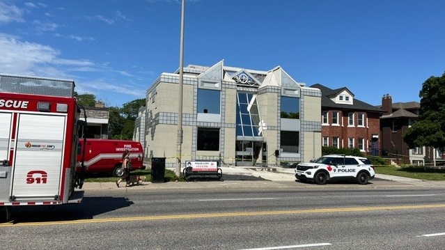 Windsor police and fire officials on scene after a fire on Ouellette Avenue in Windsor, Ont., on Wednesday, June 12, 2024. (Chris Campbell/CTV News Windsor)