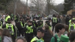 Police line the street on St. Patrick's Day weekend in 2024 during an unsanctioned event in Waterloo. (CTV News/Hannah Schmidt)