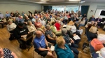 People meet to discuss the Dartmouth Cove infill project on June 12, 2024.