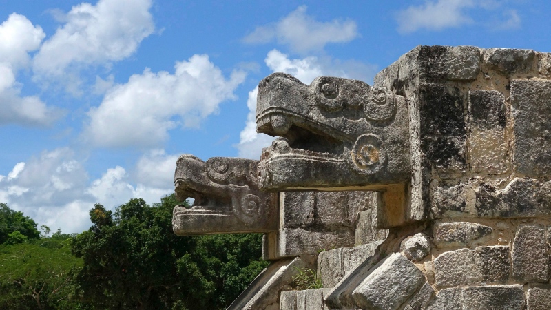 Stone-carved jaguars flank a staircase at the Chichen-Itza ruins Friday, July 22, 2016, in Yucatan, Mexico. (AP Photo/Ross D. Franklin)
