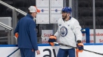 Edmonton Oilers' Evander Kane (91) talks with head coach Kris Knoblauch chat during practice before they take on the Florida Panthers in Thursday's game 3 of the NHL Stanley Cup playoffs in Edmonton on Wednesday June 12, 2024. (Jason Franson / The Canadian Press) 