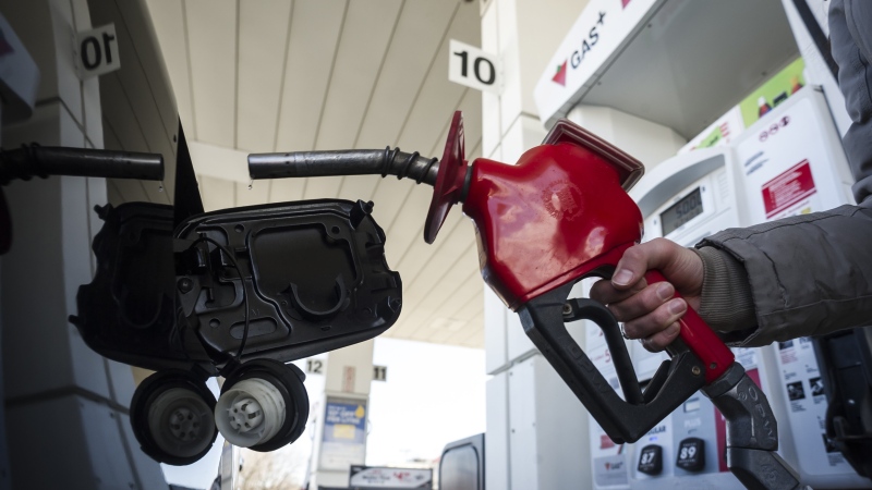 A woman fills up her with gas in Toronto, on Monday April 1, 2019.  THE CANADIAN PRESS/Christopher Katsarov