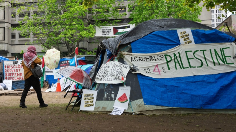 A person walks past the pro-Palestinian encampment on the McGill University campus in Montreal on May 13, 2024. (Ryan Remiorz/The Canadian Press)
Ryan Remiorz
