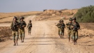 Israeli soldiers are seen near the Gaza Strip border in southern Israel, Thursday, June 13, 2024. The army is battling Palestinian militants across Gaza in the war ignited by Hamas' Oct. 7 attack into Israel. (Ohad Zwigenberg / AP Photo)