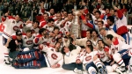 The Montreal Canadiens pose for a photograph with the Stanley Cup following their 4-1 victory over the Los Angeles Kings in Montreal in this June 9, 1993 photo. Patrick Roy front left lying down. (Frank Gunn / CP PHOTO)
