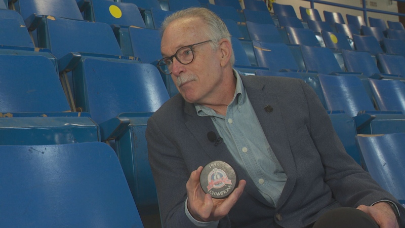 Veteran NHL columnist Dave Stubbs shows off a 1993 championship puck during an interview with CTV News. 