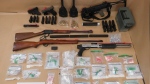 CBSA investigators seized multiples weapons and hundreds of grams of drugs from a Nanaimo, B.C., property, the agency said. (CBSA)