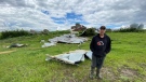 Henry Delichte is pictured on June 13, 2024 in Saint Alphonse, Man. with the wreckage of his neighbour's shed that was obliterated by a tornado. (Danton Unger/CTV News Winnipeg)