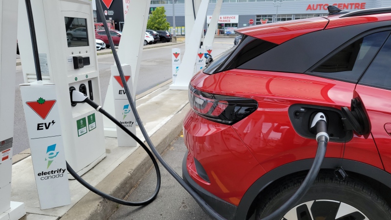 A 2022 Volkswagen ID. 4 EV is shown at a charging station at a Scarborough, Ontario Canadian Tire on Wednesday June 14, 2023. (Doug Ives / The Canadian Press)