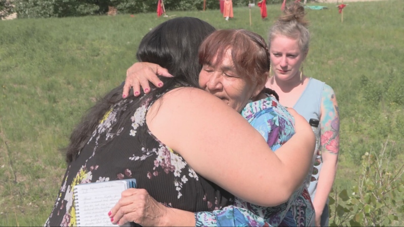 Donna Bartlett (right), the grandmother of Marcedes Myran whose remains are believed to be in the Prairie Green landfill, is seen hugging someone after talking about the update on the landfill search on June 13, 2024. (Glenn Pismenny/CTV News Winnipeg)