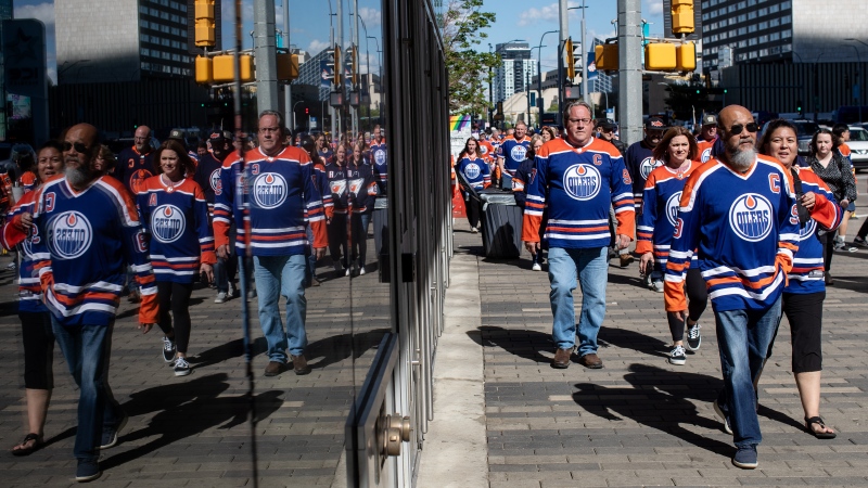 Fans make their way to watch the Florida Panthers and Edmonton Oilers in game 3 of the NHL Stanley Cup final in Edmonton on Thursday, June 13, 2024. (Jason Franson / The Canadian Press)