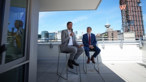 British Columbia Premier David Eby, left, speaks as Newfoundland and Labrador Premier Andrew Furey listens during a news conference at Bob & Michael's Place, a social housing complex in the Downtown Eastside of Vancouver, on Thursday, June 13, 2024. THE CANADIAN PRESS/Darryl Dyck
