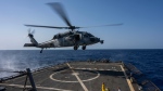 A helicopter lands on the guided missile destroyer USS Laboon in the Red Sea on Wednesday, June 12, 2024. (Bernat Armangue / AP Photo)