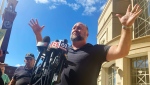 Alex Jones speaks to the media outside the courthouse, in Waterbury, Conn., Sept. 21, 2022. (Michael Hill / The Associated Press)