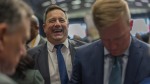 Democratic Alliance leader John Steenhuisen laughs at the end of the swearing in ceremony for members of parliament in Cape Town, South Africa, Friday, June 14, 2024. (AP Photo/Jerome Delay)