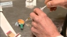 Drug injection tools are pictured in this still image. 