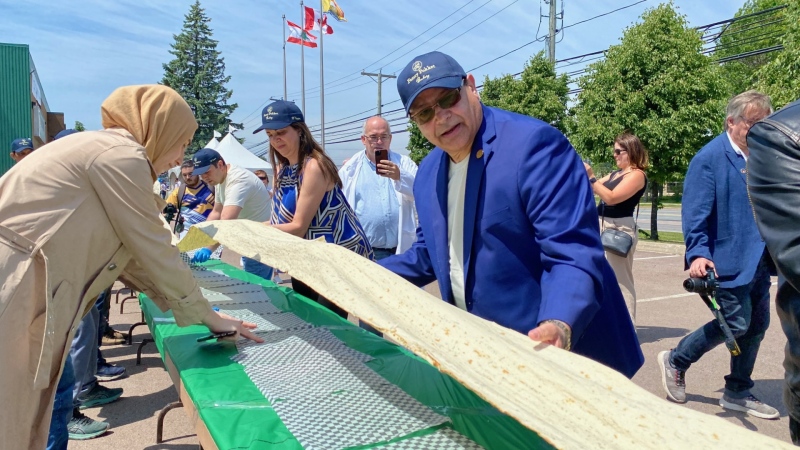 Fancy Pokket created a 220-foot long flatbread to celebrate its 35th anniversary. (Source: Derek Haggett/CTV News Atlantic)
