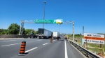 Police say a dump truck hit an overhead sign on the QEW in Niagara Falls on Friday, June 14, 2024. (X/OPP_HSD)