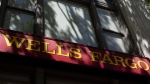 A sign for a Wells Fargo location is seen on Tuesday, May 14, 2024, in Portland, Ore. (AP Photo/Jenny Kane)