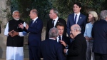 Prime Minister Justin Trudeau, third from right, and Prime Minister of India Narendra Modi, left, take part in a family photo during the G7 Summit in Savelletri Di Fasano, Italy on Friday, June 14, 2024. THE CANADIAN PRESS/Sean Kilpatrick
