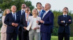 From left, European Council President Charles Michel, Japan's Prime Minister Fumio Kishida, Canada's Prime Minister Justin Trudeau, Britain's Prime Minister Rishi Sunak, European Commission President Ursula von der Leyen, French President Emmanuel Macron, German Chancellor Olaf Scholz and U.S. President Joe Biden look up as they watch a skydiving demonstration, at the G7 summit, Thursday, June 13, 2024, in Fasano, Italy. (Alex Brandon/AP Photo) 