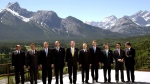 G8 leaders pose for photographers at the G8 summit in Kananaskis, Alberta, Wednesday, June 26, 2002. From left are: Italian Prime Minister Silvio Berlusconi, German Chancellor Gerhard Schroeder, U.S. President George W. Bush, French President Jacques Chirac, Canadian Prime Minister Jean Chretien, Russian President Vladimir Putin, British Prime Minister Tony Blair, Japanese Prime Minister Junichiro Koizumi, Spanish Prime Minister Jose Maria Aznar, head of the rotating EU presidency, and European Commission President Romano Prodi. (THE CANADIAN PRESS/AP-Katsumi Kasahara)