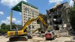 Workers knock down a former Coca-Cola Co. museum in downtown Atlanta, May 14, 2024. (AP Photo/Jeff Amy)