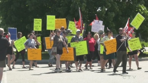 Paramedics in Sault Ste. Marie showed their displeasure with a lack of contract negotiations Friday. Dozens of EMS staff attended a social services barbecue they were invited to brandishing picket signs. (Photo from video)
