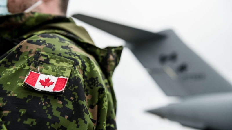 The national flag is seen on the shoulder tab of a soldier's battle dress uniform at Canadian Forces Base Trenton, in Trenton, Ont., April 14, 2022. THE CANADIAN PRESS/Christopher Katsarov