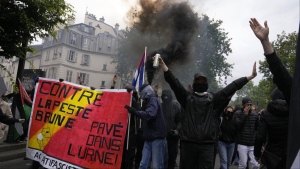 Protesters hold an anti-far right banner during a rally in Paris, Saturday, June 15, 2024.  (AP Photo/Michel Euler)