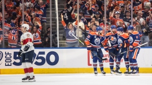 Edmonton Oilers' Leon Draisaitl (29), Brett Kulak (27), Dylan Holloway (55) and Cody Ceci (5) celebrate a goal against the Florida Panthers during first period Game 4 action of the NHL Stanley Cup final in Edmonton on Saturday June 15, 2024.THE CANADIAN PRESS/Jason Franson