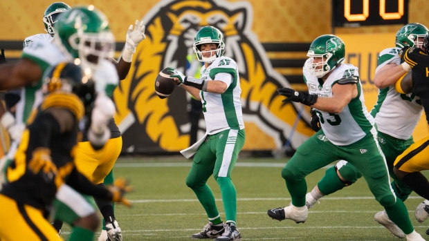 Saskatchewan Roughriders quarterback Trevor Harris (7) during first half CFL football action against the Hamilton Tiger Cats, in Hamilton, Ont., Sunday, June 16, 2024. THE CANADIAN PRESS/Peter Power