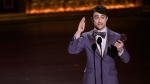 Daniel Radcliffe accepts the award for best performance by an actor in a featured role in a musical for "Merrily We Roll Along" during the 77th Tony Awards on Sunday, June 16, 2024, in New York. (Charles Sykes/Invision/AP)
