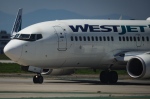 WestJet mechanics say they are poised to walk off the job early as Thursday night after serving the airline with a 72-hour strike notice yesterday. Pilots taxi a WestJet Boeing 737-700 aircraft to the runway for departure from Vancouver International Airport, in Richmond, B.C., on Friday, May 19, 2023. THE CANADIAN PRESS/Darryl Dyck