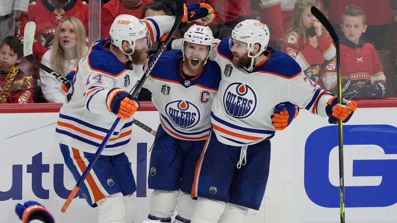 Edmonton Oilers center Connor McDavid (97) celebrates his goal during the third period of Game 5 of the NHL hockey Stanley Cup Finals against the Florida Panthers, Tuesday, June 18, 2024, in Sunrise, Fla. The Oilers defeated the Panthers 5-3. (AP Photo/Rebecca Blackwell)