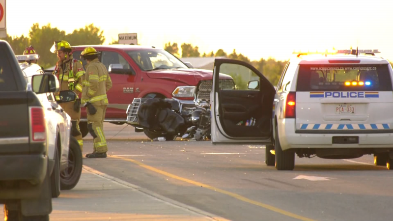 A red truck and motorcycle are seen at the scene of a crash on Highway 37 near Highway 825 in Sturgeon County the evening of June 19, 2024. (Galen McDougall / CTV News Edmonton) 