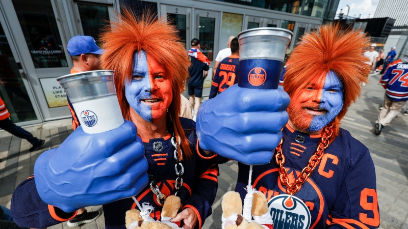 Edmonton Oilers fans Richard Schultz, left, and Brandon Lyle arrive for Game 6 of the NHL hockey Stanley Cup final against the Florida Panthers in Edmonton, Friday, June 21, 2024. THE CANADIAN PRESS/Jeff McIntosh