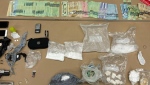 A quantity of drugs and cash allegedly seized by Toronto police is seen here. (Toronto Police Service)