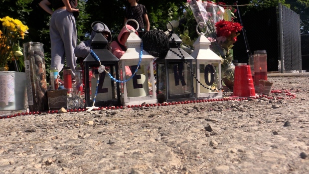 A memorial, seen on June 24, 2024, continues to grow at 1067 Southdale Rd. E. in London, Ont. in memory of Zukifili ‘Zeko’ Abdul Hashim who was killed on June 21, 2024. (Brent Lale/CTV News London)