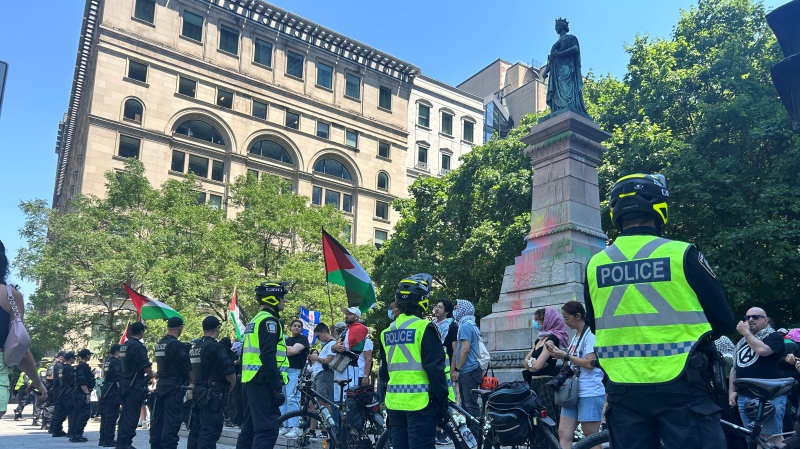 Protesters at Square Victoria attempted to topple the statue of Queen Victoria on June 25, 2024. (Olivia O'Malley, CTV News)