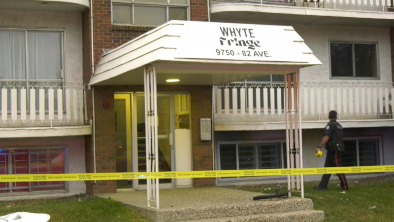 Police tape hangs in front of the Whyte Fringe apartment building on June 26, 2024. (Evan Klippenstein / CTV News Edmonton) 