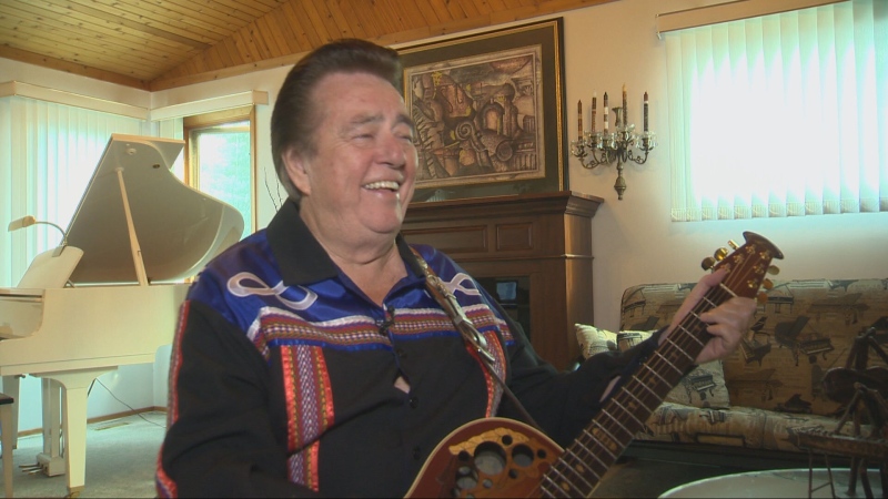 Ray St. Germain smiles while performing during an interview with CTV Winnipeg in 2014. (CTV News Winnipeg)