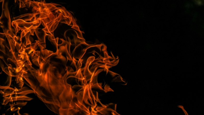 Flames cascade against a black background in this stock image. (Francesco Ungaro/Pexels.com)