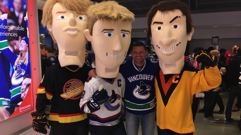 Peter Wortman, a long-time season ticket holder, is shown at a Vancouver Canucks game. 