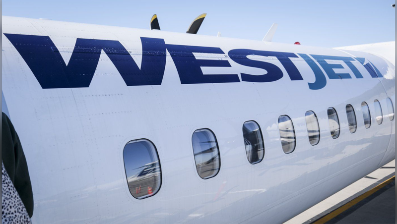 A WestJet plane waits at a gate at Calgary International Airport in Calgary, Alta., Wednesday, Aug. 31, 2022. WestJet is cancelling flights ahead of a possible strike its mechanics union. THE CANADIAN PRESS/Jeff McIntosh