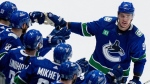 Vancouver Canucks' Nikita Zadorov celebrates with teammates after his goal against the Edmonton Oilers during Game 2 of a Stanley Cup second-round playoff series, on May 10, 2024. (THE CANADIAN PRESS/Ethan Cairns)