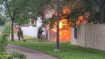 Firefighters tackle a garage fire in Riversdale on July 1, 2024. (Rory MacLean / CTV News)